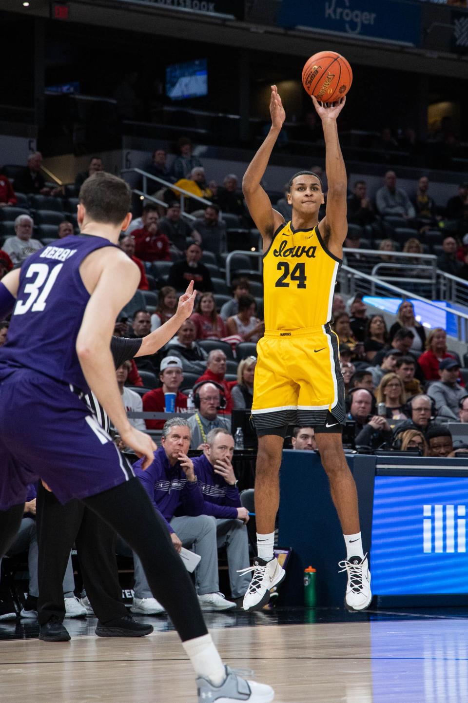 Iowa forward Kris Murray (24) shoots the ball in the first half against Northwestern at the Big Ten Conference tournament, Thursday, March 10, 2022, in Indianapolis.