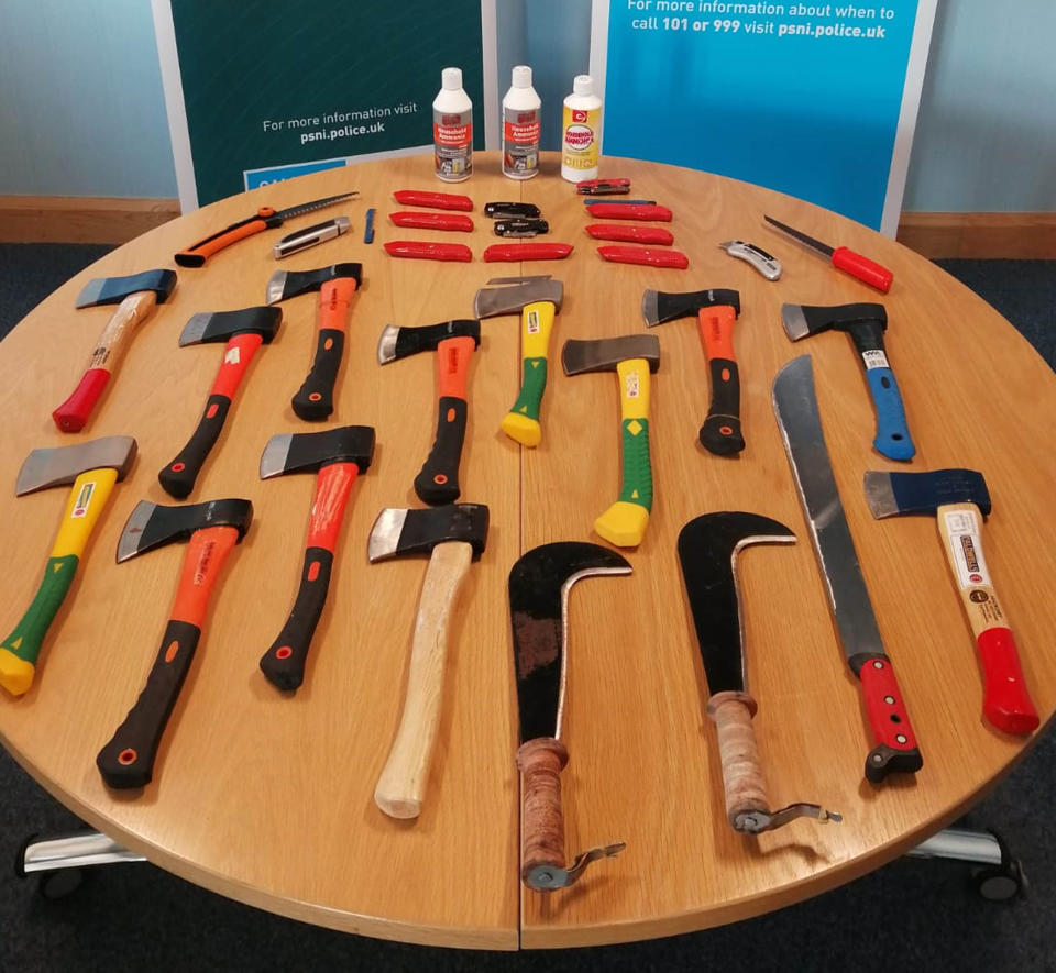 Hatchets and Stanley knives among weapons seized by the PSNI as police arrested two people after a disturbance at a funeral. (PA Images)