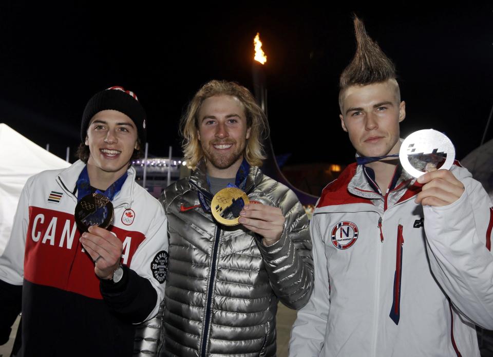 Men's snowboard slopestyle gold medalist Kotsenburg, silver medalistSandbech and bronze medalist Mark McMorris hold up their medals