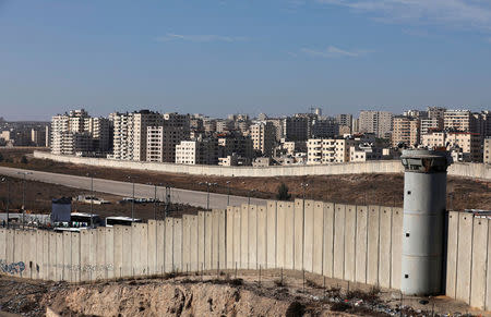 A view shows the Israeli barrier as buildings are seen in Kfar Aqab on the outskirts of Jerusalem, near the West Bank City of Ramallah, November 7, 2017. Picture taken November 7, 2017. REUTERS/Mohamad Torokman