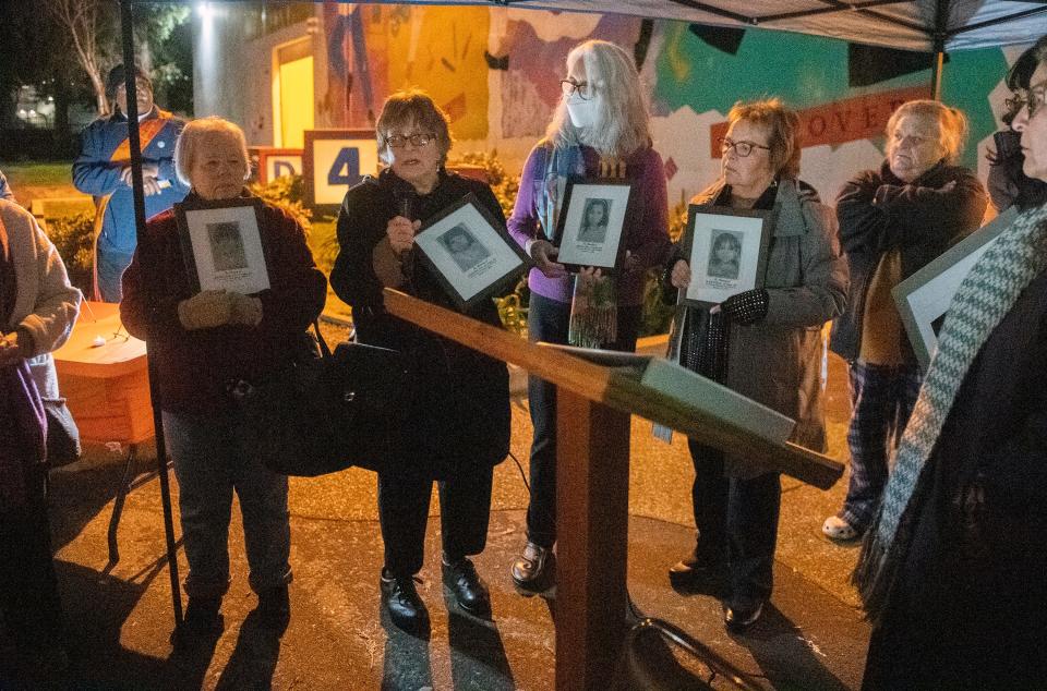 Members of Cleveland School Remembers hold photos of the children who were killed in the 1989 Cleveland School shooting, during a anniversary ceremony at the Children's Museum of Stockton in downtown Stockton on Tuesday, Jan. 17, 2023. The museum was founded by Janet Geng, as teacher who was wounded in the shooting.