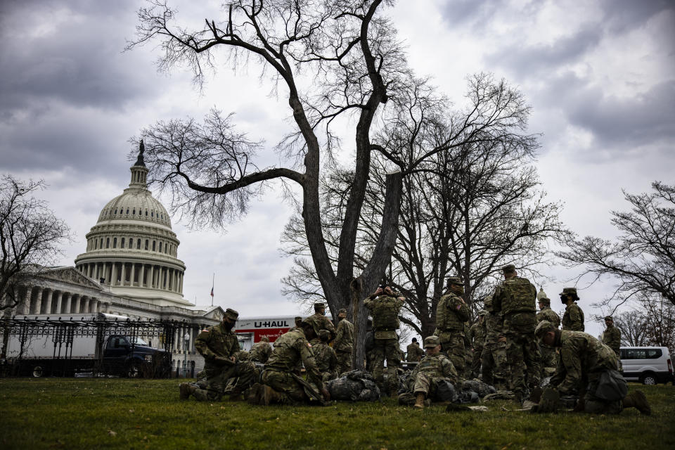 National Guard troops are seen on the lawn of the U.S. Capitol on Jan. 15. (Photo: Samuel Corum via Getty Images)