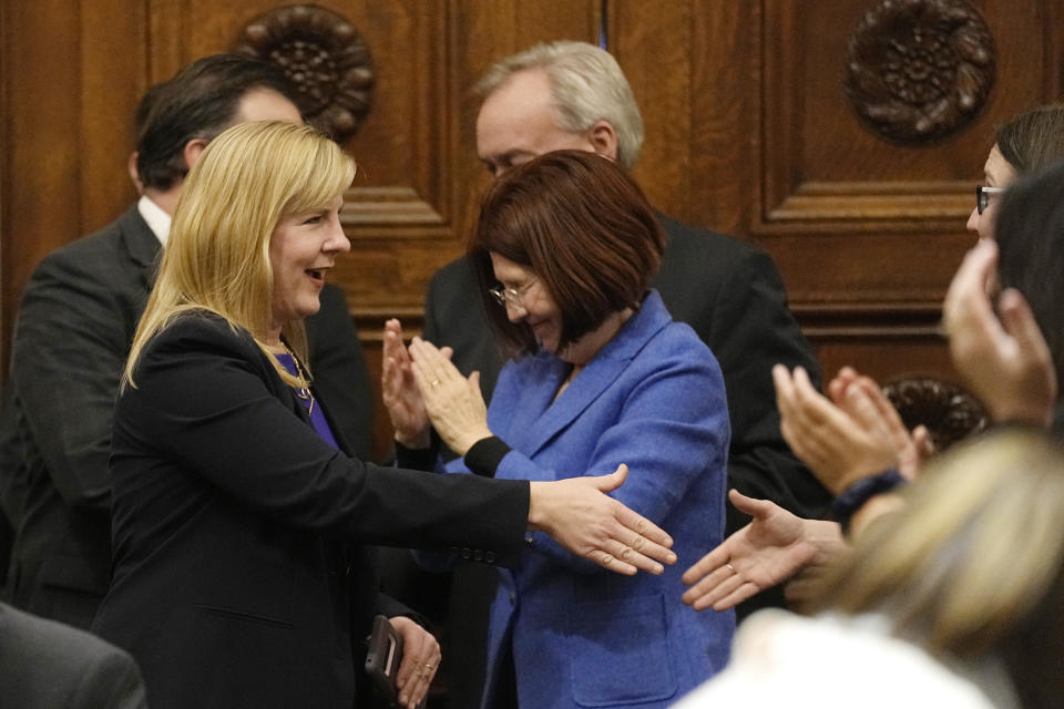House Speaker Melissa Hortman, left, shakes hands with members of the Minnesota house after being re-elected for her third term during the first day of the 2023 Legislative session, Tuesday, Jan. 3, 2023, in St. Paul, Minn. (AP Photo/Abbie Parr)