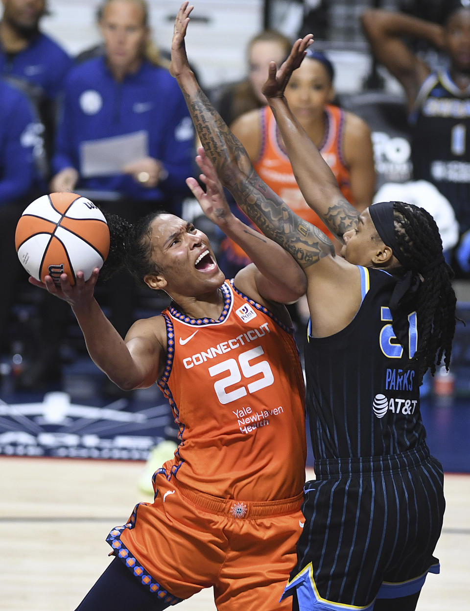 Connecticut Sun's Alyssa Thomas (25) puts up a basket against Chicago Sky's Robyn Parks (21) during a WNBA basketball game, Sunday, May 25, 2023, in Uncasville, Conn. (Sarah Gordon/The Day via AP)