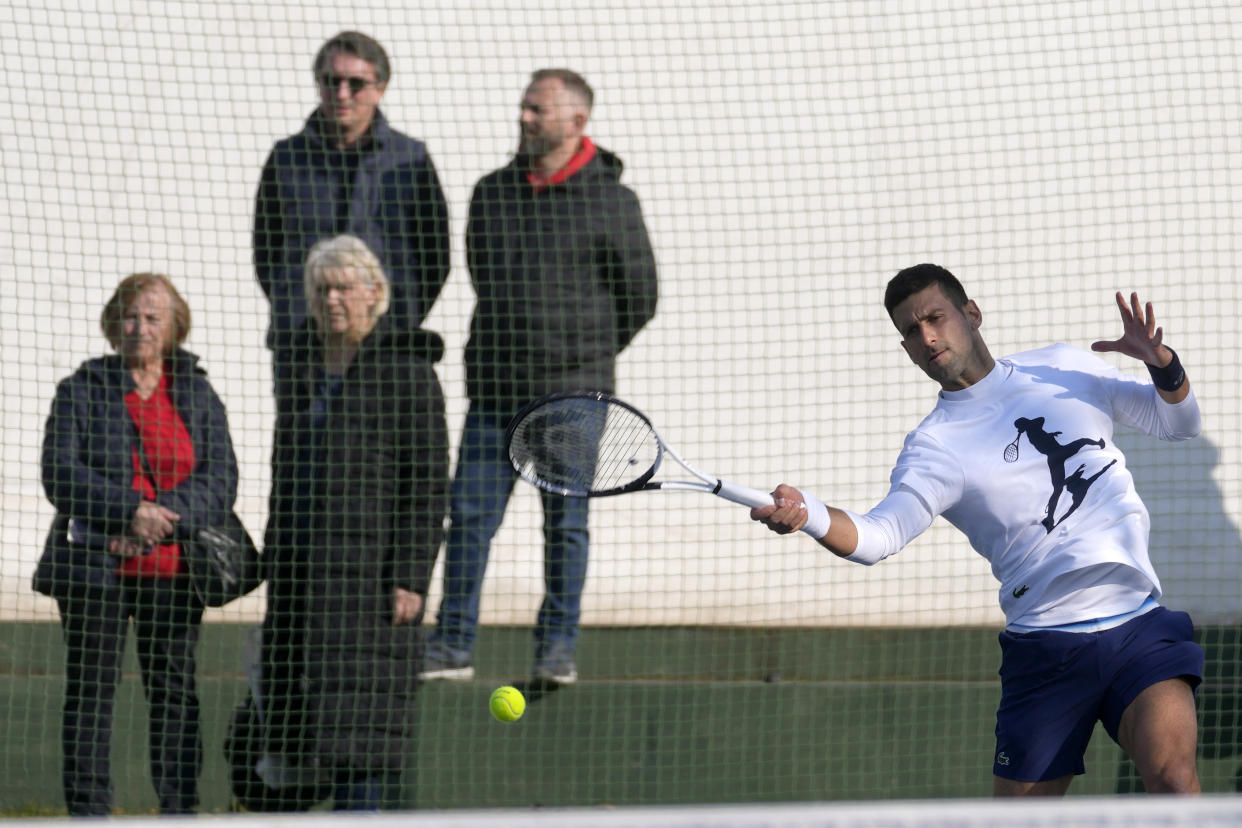 Serbian tennis player Novak Djokovic returns the ball during his open practise session in Belgrade, Serbia, Wednesday, Feb. 22, 2023. Djokovic said Wednesday he still hopes US border authorities would allow him entry to take part in two ATP Masters tennis tournaments despite being unvaccinated against the coronavirus. (AP Photo/Darko Vojinovic)