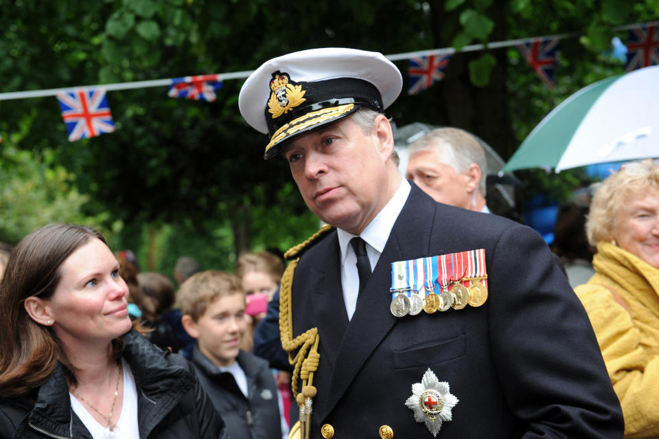 LONDON, ENGLAND - JUNE 03: Prince Andrew, Duke of York (R) attends the 'Big Jubilee Lunch' at All Saints Church in Fulham ahead of the Diamond Jubilee River Pageant on June 3, 2012 in London, England. For only the second time in its history the UK celebrates the Diamond Jubilee of a monarch. Her Majesty Queen Elizabeth II celebrates the 60th anniversary of her ascension to the throne. Thousands of well-wishers from around the world have flocked to London to witness the spectacle of the weekend's celebrations. The Queen along with all members of the royal family will participate in a River Pageant with a flotilla of a 1,000 boats accompanying them down The Thames. (Photo by Matt Grayson - WPA Pool/Getty Images)