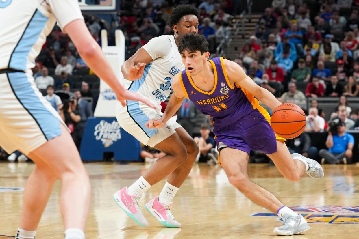 Scottsburg Warriors Jack Miller (11) drives the lane against the South Bend St. Joseph Huskies on Saturday, March 30, 2024, during the IHSAA boys basketball Class 3A state championship game at Gainbridge Fieldhouse in Indianapolis. The Scottsburg Warriors defeated the South Bend St. Joseph Huskies 67-57.