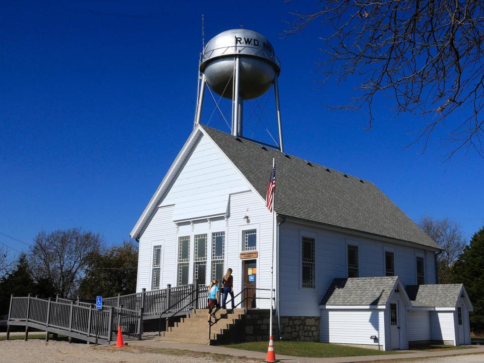 Voters enters Kanwaka Township Hall, a polling place in rural Douglas County near Lawrence, Kansas.