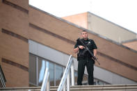 <p>A police officer stands guard outside the Orlando Regional Medical Center hospital after a fatal shooting at a nearby Pulse Orlando nightclub in Orlando, Fla., Sunday, June 12, 2016. (AP Photo/Phelan M. Ebenhack) </p>