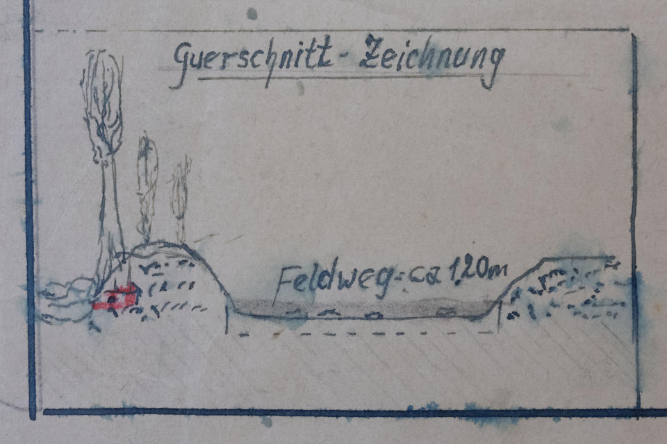FILE - Detail of the map showing a cross-section of the road where the Nazi loot was reportedly buried in Ommeren, near Arnhem, at the National Archive of the Netherlands in The Hague, on Jan. 23, 2023. An officially sanctioned hunt for a stash of precious jewelry looted by the Nazis during World War II and purportedly buried in a sleepy rural Dutch village has — like many previous searches — failed to unearth any treasure. (AP Photo/Peter Dejong, File)