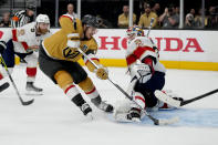 Vegas Golden Knights center Brett Howden, left, scores on Florida Panthers goaltender Sergei Bobrovsky during the second period of Game 2 of the NHL hockey Stanley Cup Finals, Monday, June 5, 2023, in Las Vegas. (AP Photo/John Locher)