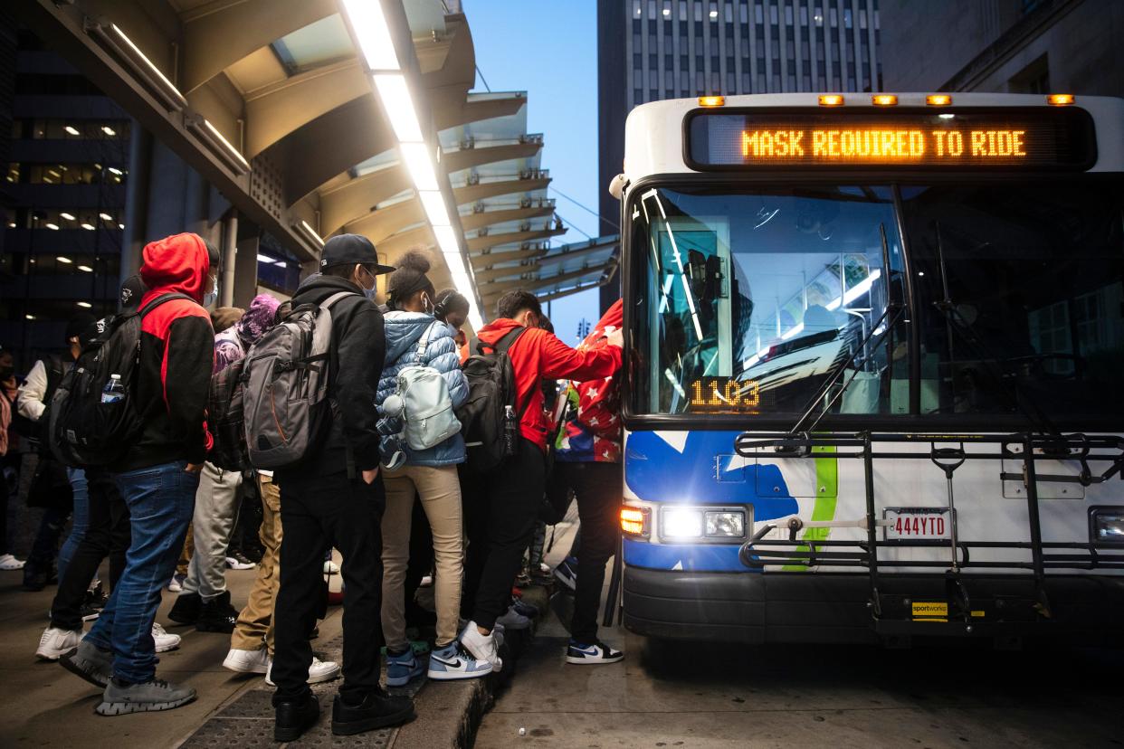 The Metro bus is free through Saturday, March 26, 2022. Early morning riders, mostly students, board the bus at Government Square, Monday, March 21, 2022. The free rides are a way to help people look for alternative methods of travel as gas prices soar. 