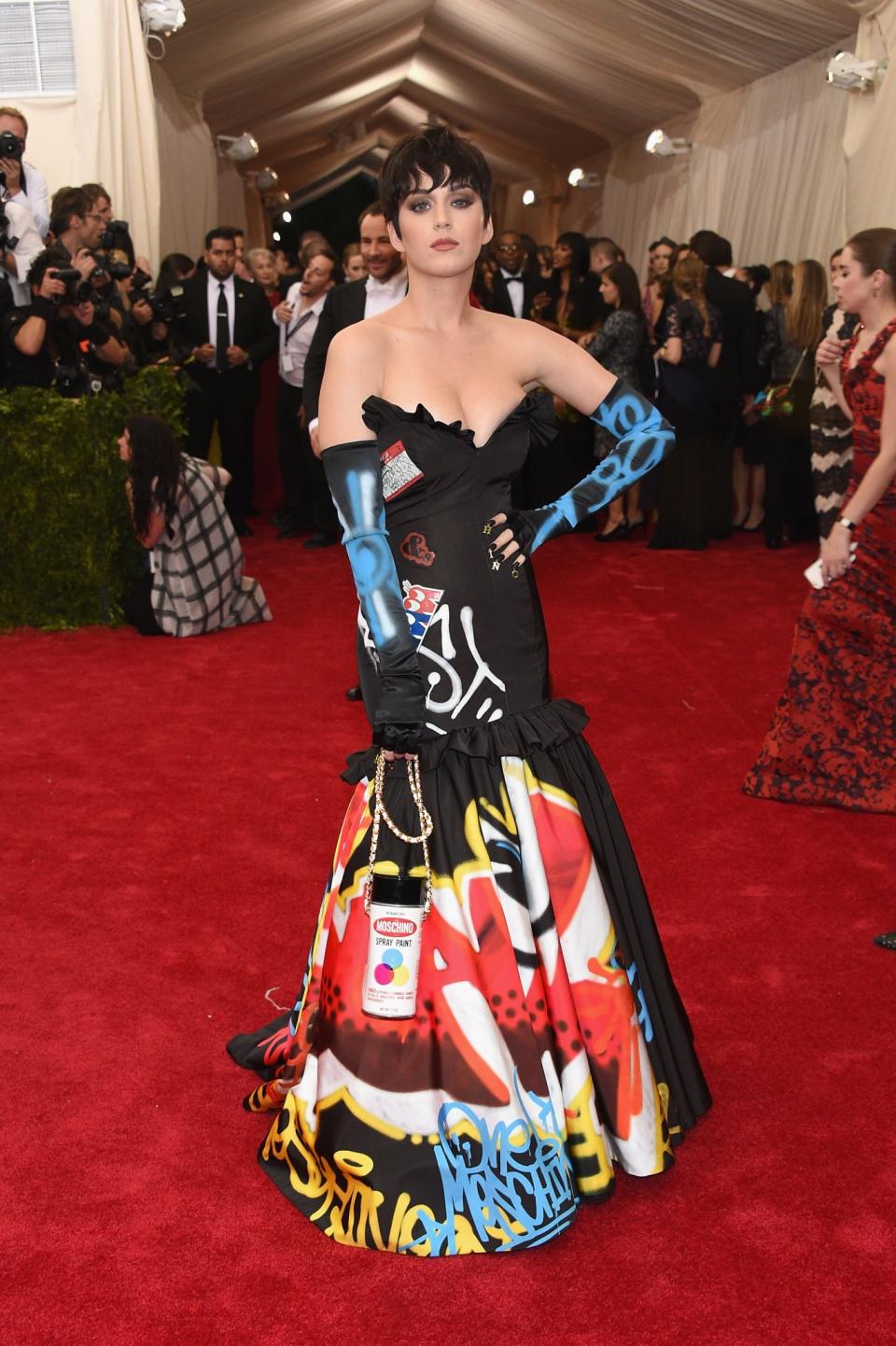 <p>Never afraid to break a few style rules, at the 2015 Met Gala Katy absolutely rocked this punked up ball gown by Moschino. [Photo: Getty] </p>