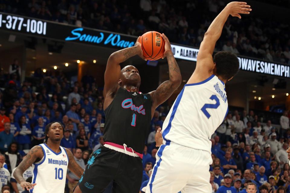 Feb 25, 2024; Memphis, Tennessee, USA; Florida Atlantic Owls guard Johnell Davis (1) shoots as Memphis Tigers forward Nicholas Jourdain (2) defends during the second half at FedExForum. Mandatory Credit: Petre Thomas-USA TODAY Sports