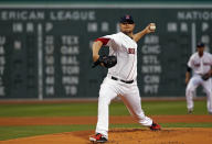 Boston Red Sox starting pitcher Jon Lester delivers to the New York Yankees during the first inning of a baseball game at Fenway Park in Boston, Tuesday, April 22, 2014. (AP Photo/Elise Amendola)