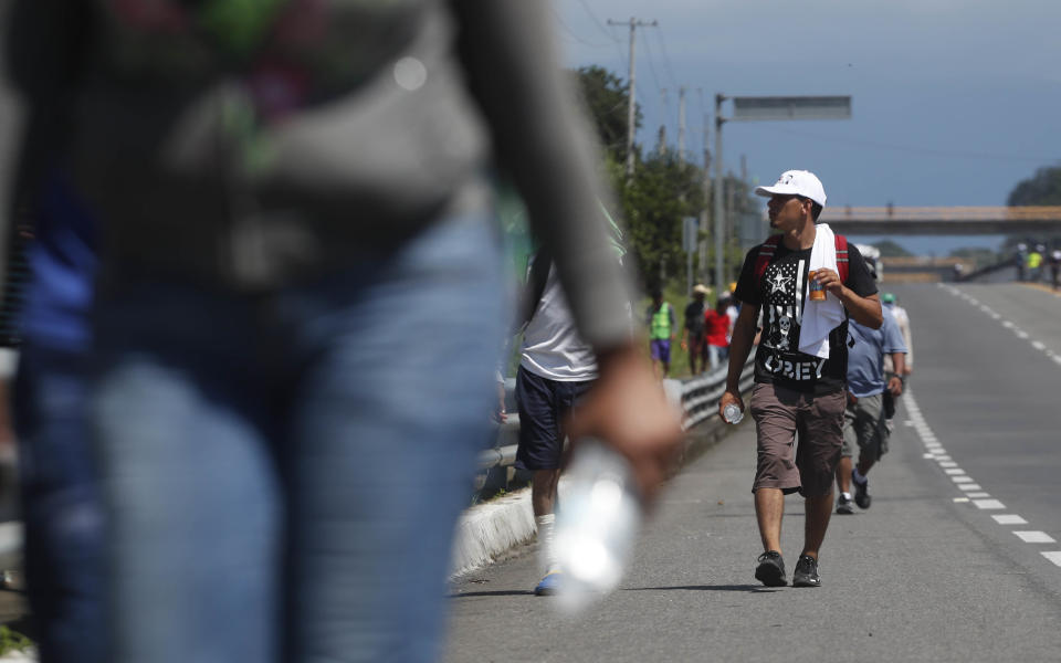 Central American migrants making their way to the U.S. arrive by foot to Tapachula, Mexico, Sunday, Oct. 21, 2018. Despite Mexican efforts to stop them at the Guatemala-Mexico border, about 5,000 Central American migrants resumed their advance toward the U.S. border Sunday in southern Mexico. (AP Photo/Moises Castillo)