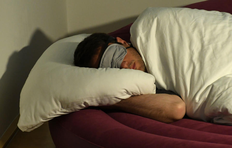 Artist Virgile Novarina sleeps in a bed as part of installation entitled 'Sleep: A Productive Waste of Time' in the Paula Modersohn-Becker Museum in Bremen, Germany, 21 September 2017. The installation can be seen between the 24 September and the 4 February 2018. Photo: Carmen Jaspersen/dpa (Photo by Carmen Jaspersen/picture alliance via Getty Images)