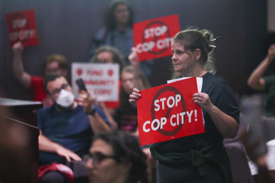 Protestors reacts before the council members voted 11 to 4 to approve legislation to fund the training center, on Tuesday, June 6, 2023, in Atlanta. (Jason Getz/Atlanta Journal-Constitution via AP)