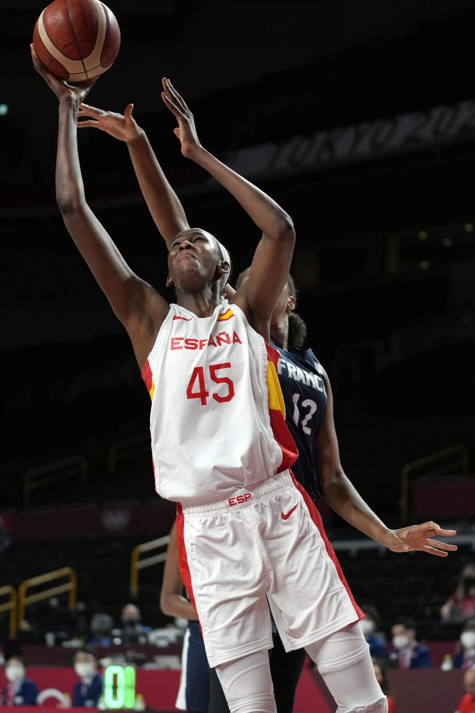 Spain's Astou Ndour (45) drives to the basket ahead of France's Iliana Rupert (12) during a women's basketball quarterfinal round game at the 2020 Summer Olympics, Wednesday, Aug. 4, 2021, in Saitama, Japan. (AP Photo/Eric Gay)