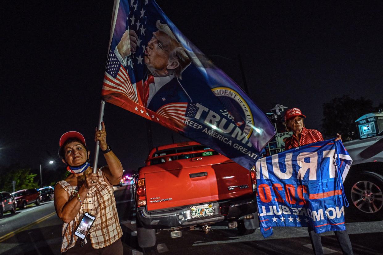 Supporters of former US President Donald Trump stand outside his residence in Mar-A-Lago, Palm Beach, Florida on August 8, 2022. 