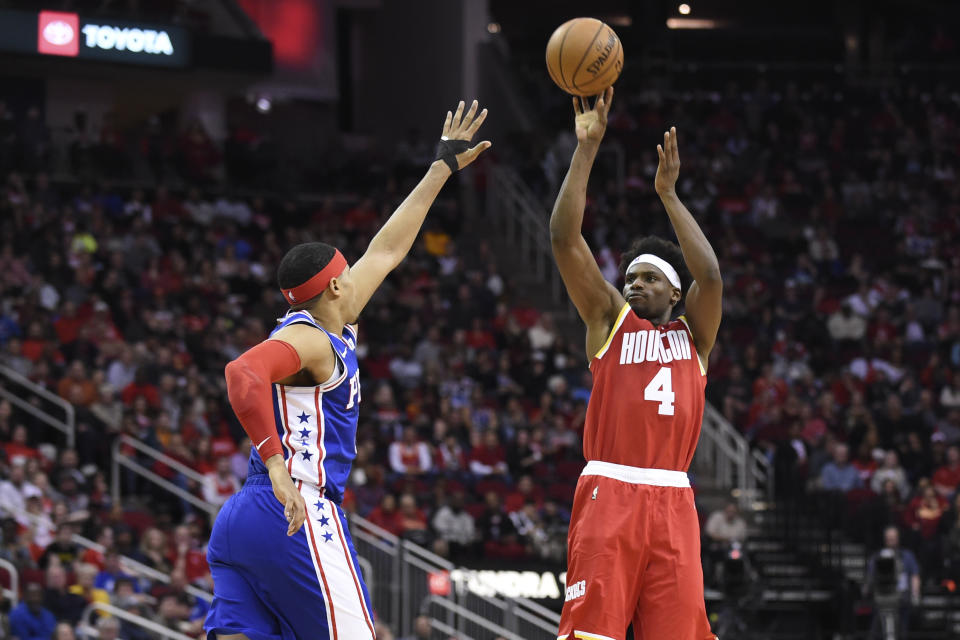 Houston Rockets forward Danuel House Jr. (4) shoots as Philadelphia 76ers forward Tobias Harris defends during the first half of an NBA basketball game Friday, Jan. 3, 2020, in Houston. (AP Photo/Eric Christian Smith)