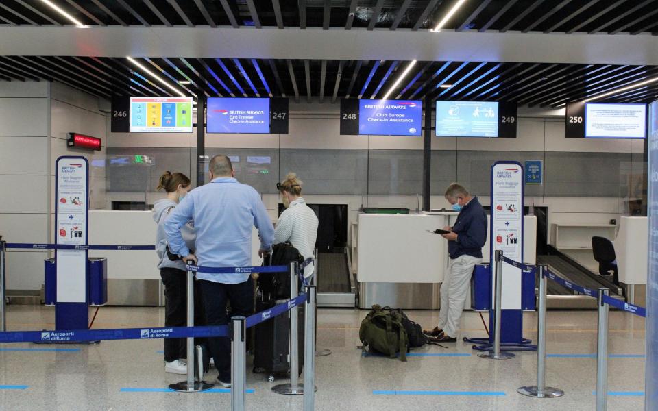 Italian and British passengers at Fiumicino airport, near Rome, Italy, 18 October 2020. United Kingdom imposed a 14-day quarantine provision for people arriving from Italy from 18 October 2020. - TELENEWS/EPA-EFE/Shutterstock