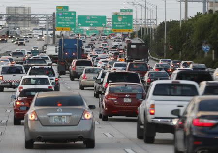 Rush hour traffic is shown on Interstate 95 near downtown Miami, Florida November 5, 2015. Nearly two-thirds of Americans would support roadway user fees to help fix the country's crumbling transportation infrastructure, according to a survey to be published on April 28, 2016 that was seen by Reuters. REUTERS/Joe Skipper/File Photo