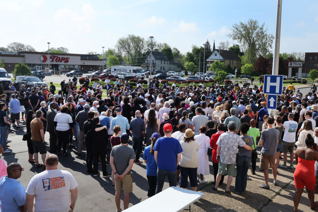 People gather outside the Tops supermarket in Buffalo, N.Y.