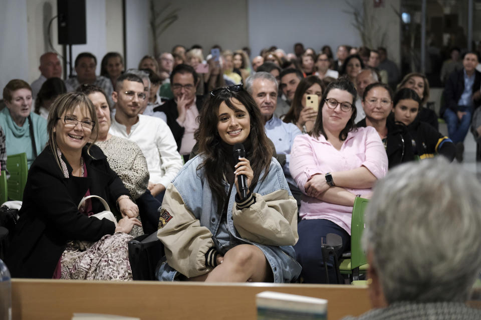 Cuban-born American singer and songwriter Camila Cabello smiles during an event to present her grandmother's book in Malaga, Spain, Thursday, March 23, 2023. When she's not singing or dancing, Cabello likes to support members of her family, such as grandmother Mercedes Rodriguez, who has recently published her debut novel in Spanish titled "Los boleros que he vivido". (AP Photo/Gregorio Marrero)