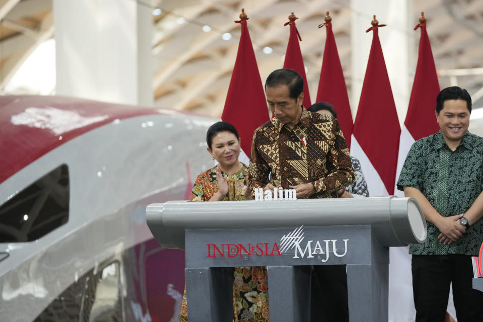 Indonesian president signing during opening ceremony launch Southeast Asia's first high-speed railway at Halim station in Jakarta, Indonesia, Monday, Oct. 2, 2023. Indonesian President Joko Widodo launched Southeast Asia's first high-speed railway that will start its commercial operations on Monday, a key project under China's Belt and Road infrastructure initiative that will cut travel time between two cities from the current three hours to about 40 minutes. (AP Photo/Achmad Ibrahim)