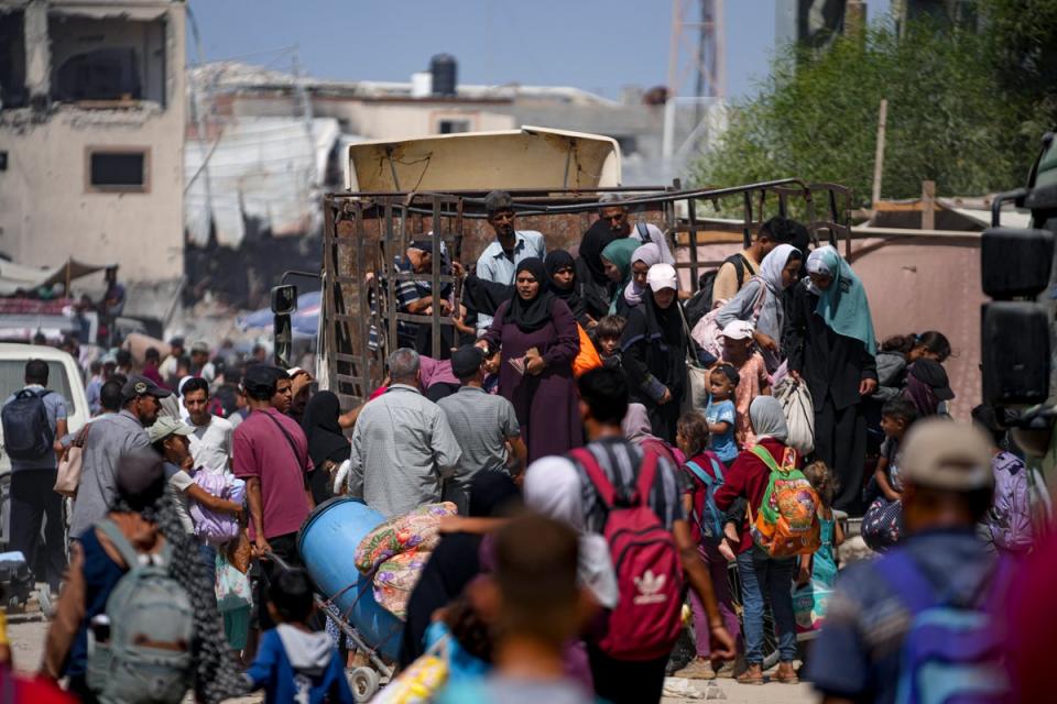 Palestinians displaced by the Israeli air and ground offensive on the Gaza Strip flee (Copyright 2023, The Associated Press. All rights reserved)