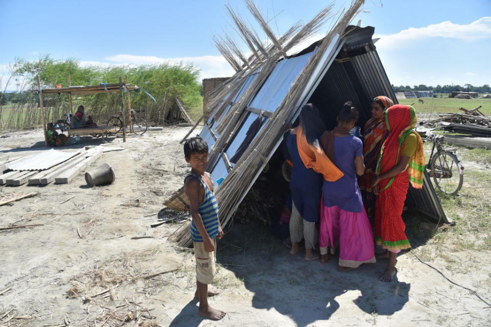 Villagers on Sept. 27 take shelter with their belongings after their house was demolished during an eviction drive, at Gorukhuti in the Darrang district of Assam, India<span class="copyright">Anuwar Ali Hazarika/Barcroft Media via Getty Images</span>