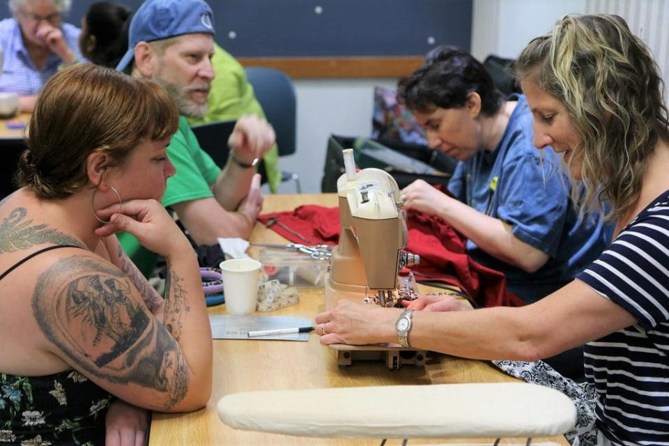 A volunteer mends a patron’s item at the 2018 Fix-It Fair. This year’s fair will take place from 11 a.m.-4 p.m. Saturday, June 4,  at the downtown library, 303 E. Kirkwood Ave.