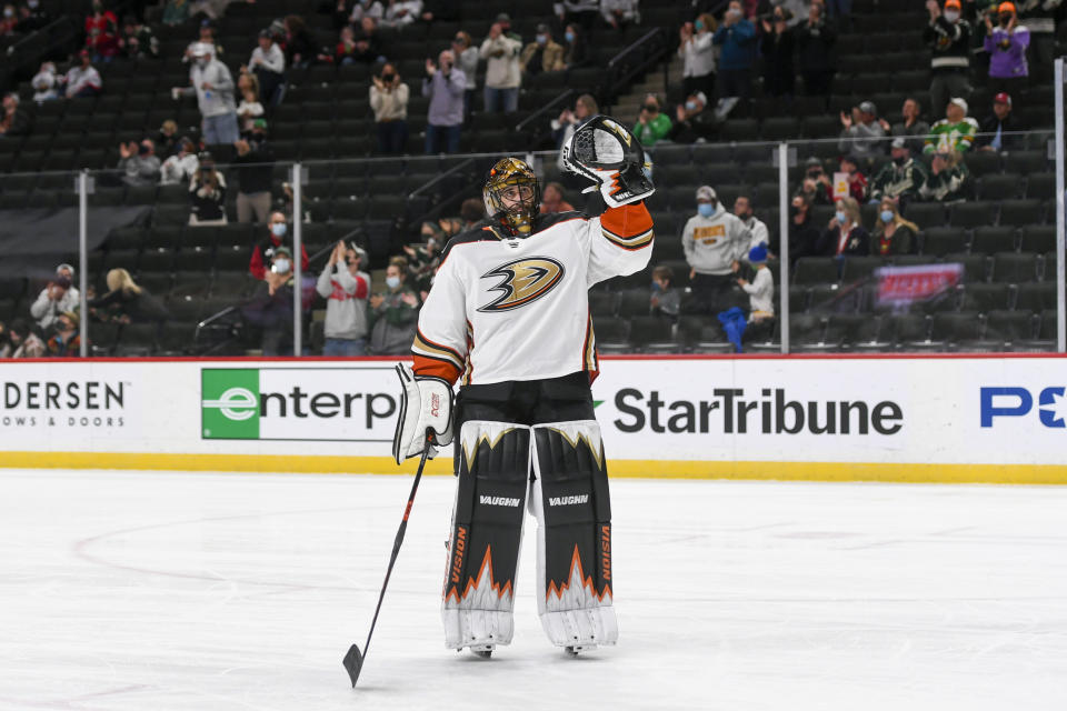 Anaheim Ducks goalie Ryan Miller waves to the crowd during a standing ovation after it was announced that this would be his last NHL hockey game, against the Minnesota Wild on Saturday, May 8, 2021, in St. Paul, Minn. (AP Photo/Craig Lassig)