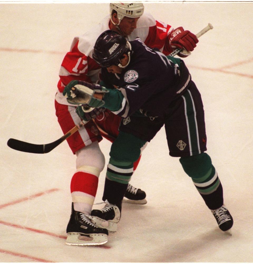Detroit Red Wings' Doug Brown and Anaheim Mighty Ducks' Richard Park battle during the game at Joe Louis Arena, March 30, 1997. Detroit lost to Anaheim in OT, 1-0.