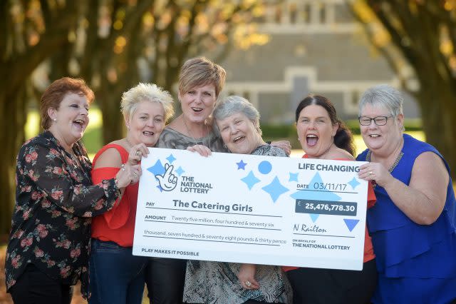 EuroMillions winners Julie Saunders, Doreen Thompson, Julie Amphlett, Jean Cairns, Louise Ward and Sian Jones celebrate during a photocall at Hensol Castle