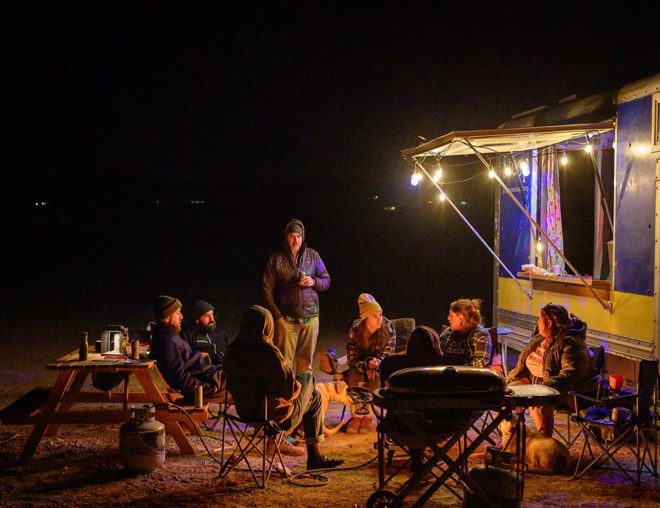 A group of travelers at Van Life Campground in Joshua Tree, California.