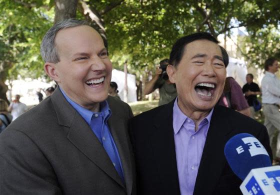 Actor George Takei (R) and partner Brad Altman are interviewed after applying for a marriage license in West Hollywood, California, June 17, 2008.