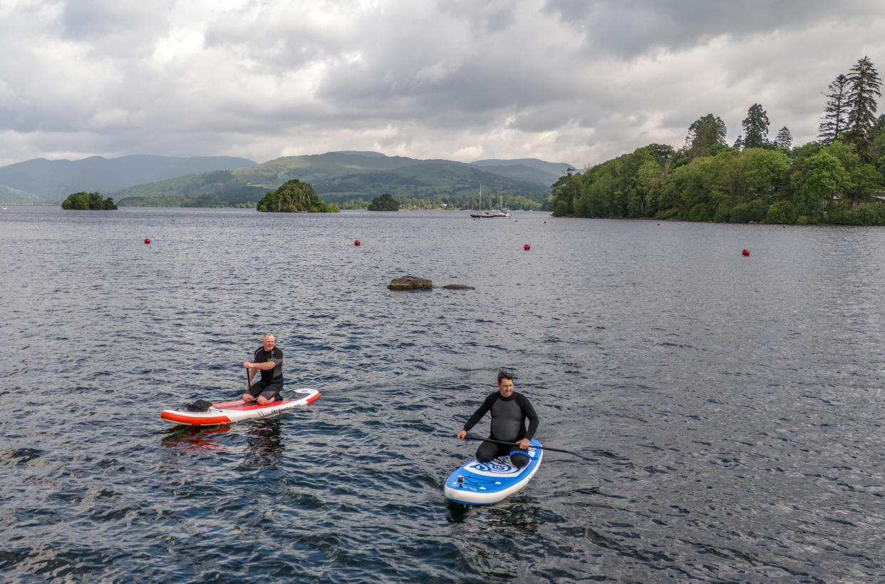 Paddle boarders on Lake Windermere in Cumbria. Picture date: Wednesday June 5, 2024. (Photo by Danny Lawson/PA Images via Getty Images)