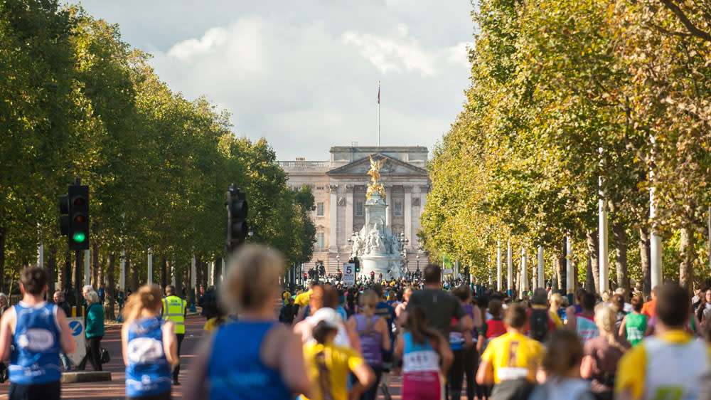  Runners in the Royal Parks Half Marathon on the Mall approaching Buckingham Palace. 