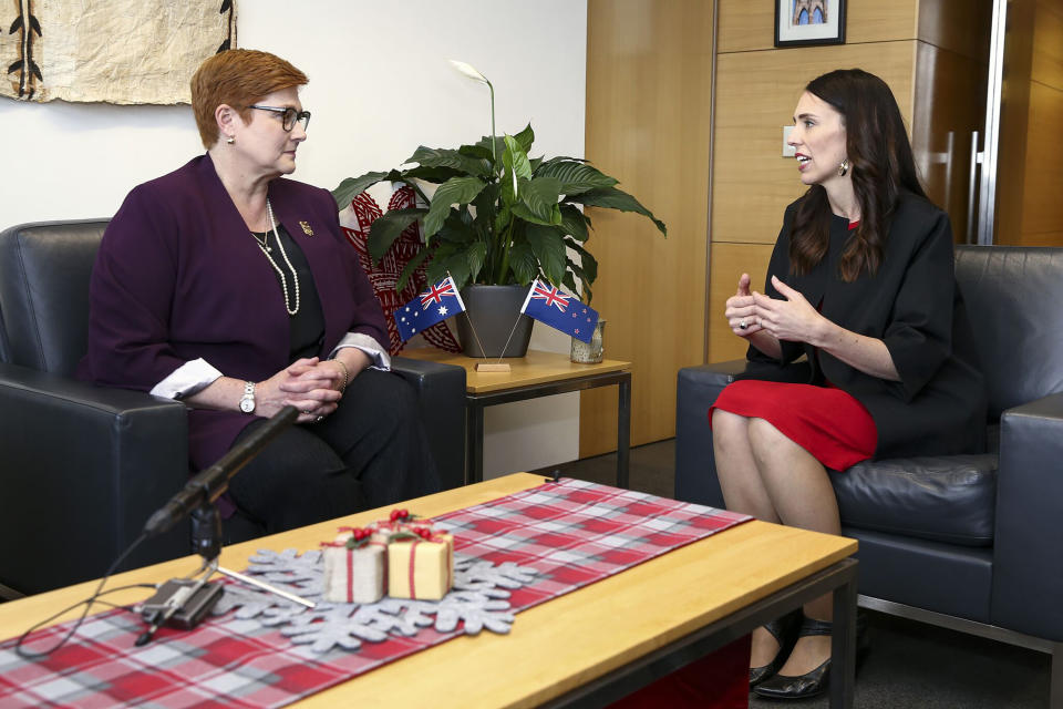 CORRECTS SPELLING TO MARISE INSTEAD OF MARISA - New Zealand Prime Minister Jacinda Ardern, right, speaks to Australian Foreign Minister Marise Payne during a meeting in Wellington, New Zealand, Monday, Dec 16, 2019. Payne is in Wellington to thank some of the first responders who helped at the White Island volcano eruption on Dec. 9. (Hagen Hopkins/Pool Photo via AP)