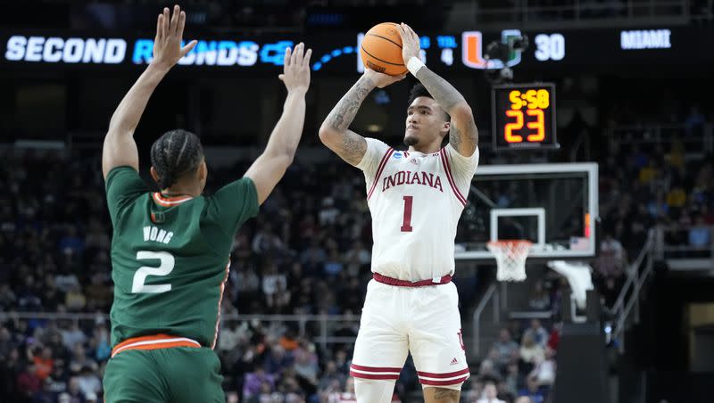 Indiana’s Jalen Hood-Schifino (1) shoots over Miami’s Isaiah Wong (2) in the first half of a second-round college basketball game in the NCAA Tournament, Sunday, March 19, 2023, in Albany, N.Y. 