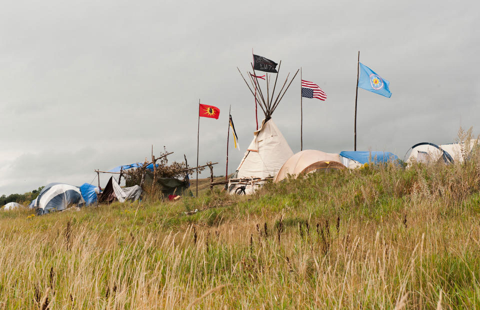 <p>Tepees stand in the Seven Council camp where protesters who oppose the Dakota Access oil pipeline near the Standing Rock Sioux reservation have gathered, in Cannon Ball, N.D., on Sept. 7, 2016. (Photo: Andrew Cullen/Reuters) </p>