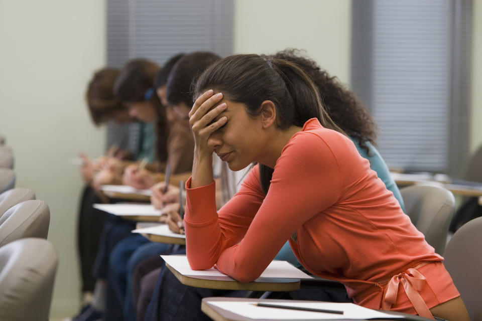 student stressed out at their desk