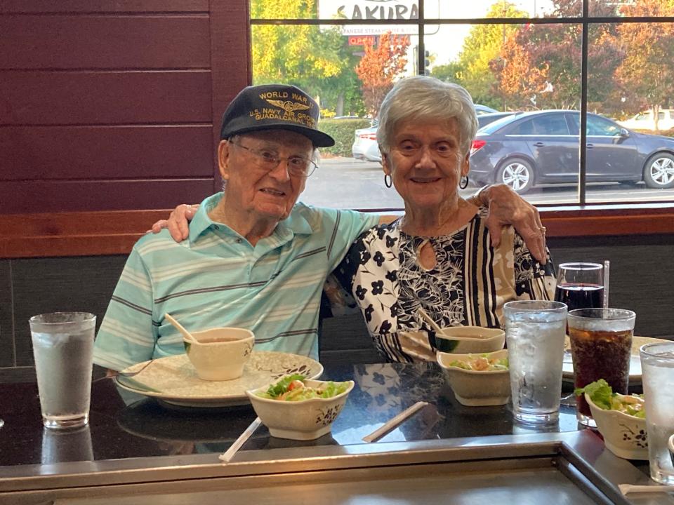 World War II veteran Richard Mirelles and his wife, Joy, sitting in a restaurant together