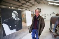 Antony Penrose, son of American photographer and surrealist Lee Miller, poses inside the exhibition of his mothers work, which he curates, at Farleys House & Gallery