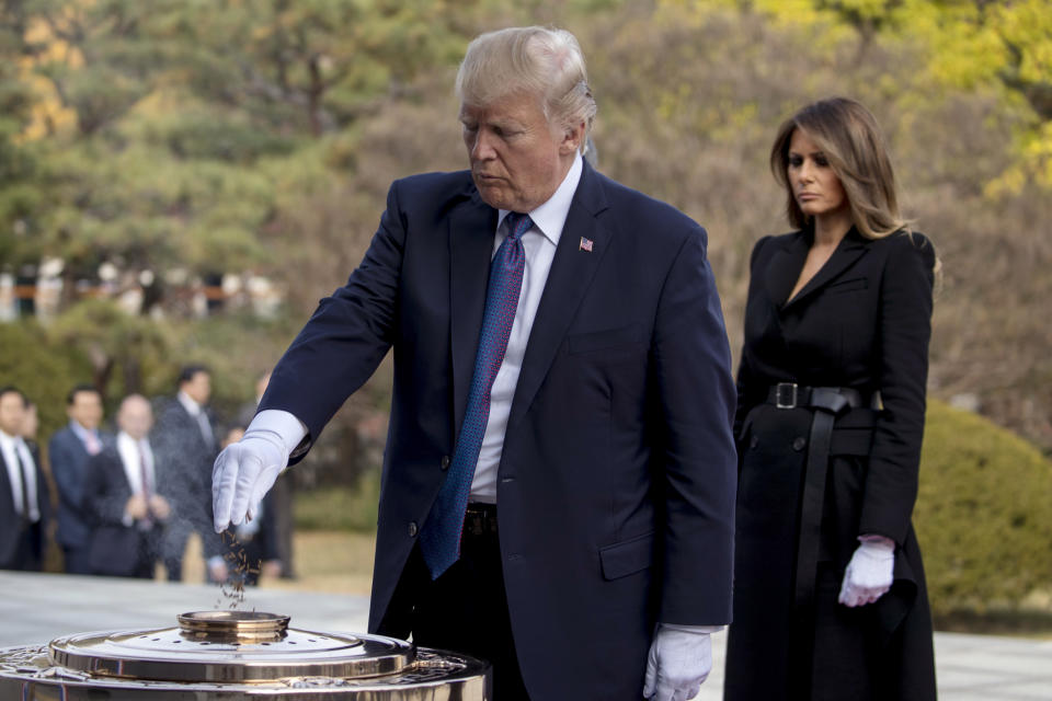 <p>President Donald Trump with first lady Melania Trump burns incense at the South Korean National Cemetery in Seoul, South Korea Wednesday, Nov. 8, 2017. (Photo: Andrew Harnik/AP) </p>