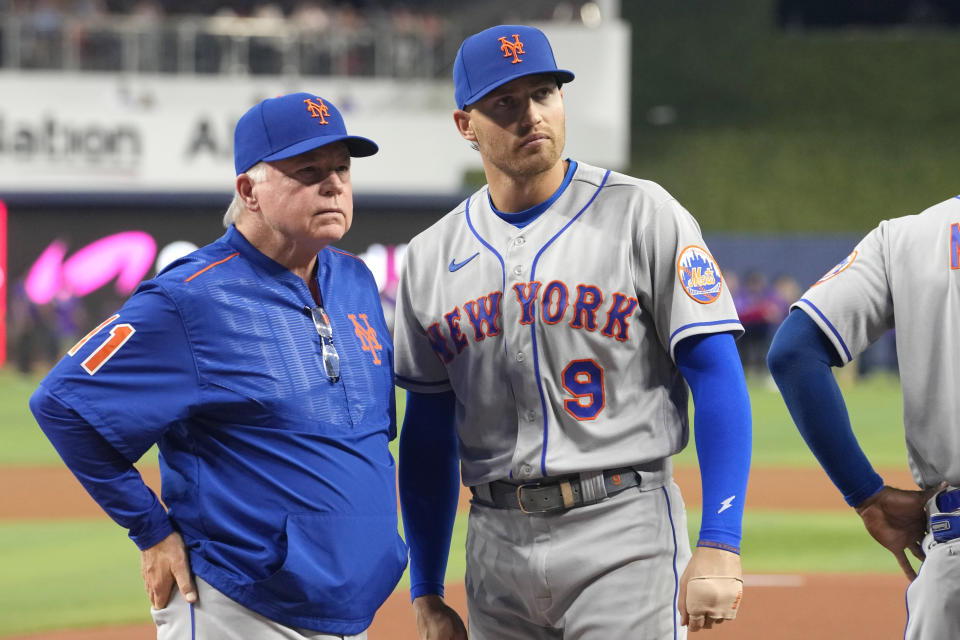 New York Mets manager Buck Showalter, left, stands with center fielder Brandon Nimmo (9) before an opening day baseball game against the Miami Marlins, Thursday, March 30, 2023, in Miami. (AP Photo/Lynne Sladky)
