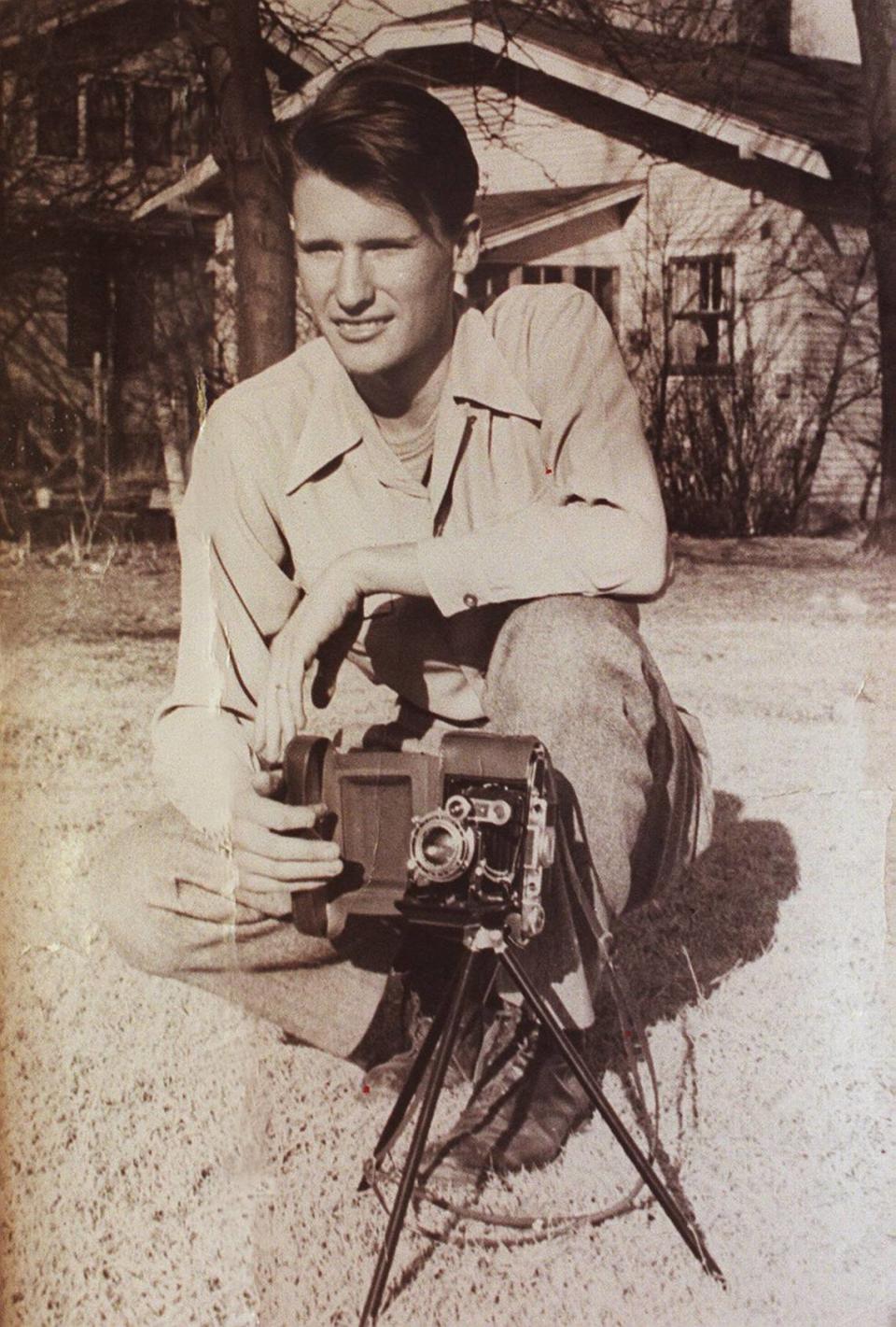 A 20-year-old Schuyler Jones posed with a camera in Wichita before he left America seeking adventure.