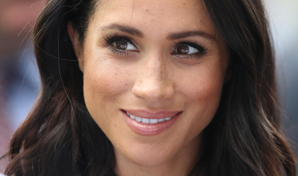 Meghan Markle trusts YSL's Touche Éclat High Cover Radiant Under-Eye Concealer to provide coverage with a natural finish. (Image via Getty Images)